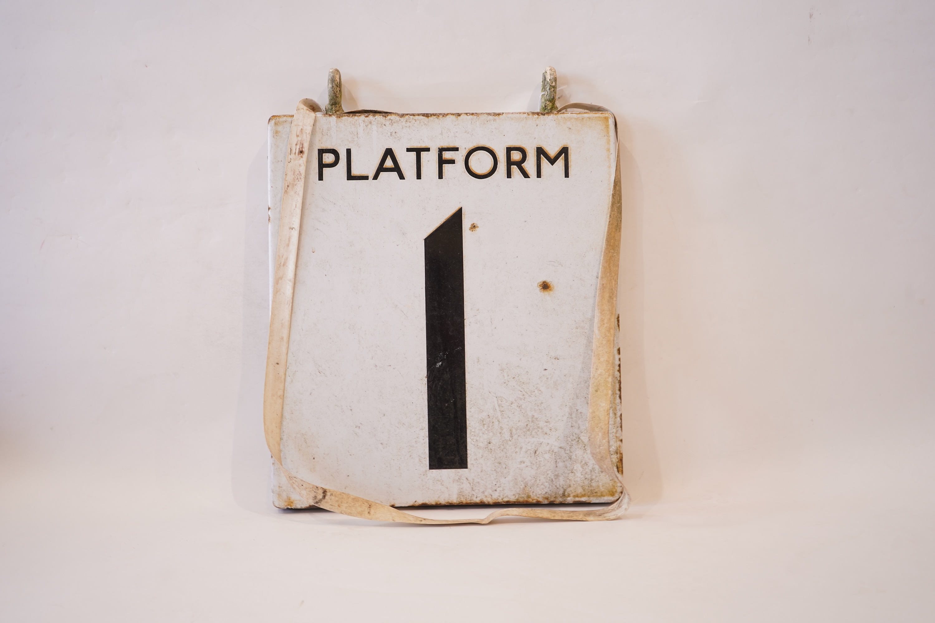 A 1960s London Underground double sided enamel platform sign 'Platform 1', with black lettering on white background, 46cm high, 41cm wide